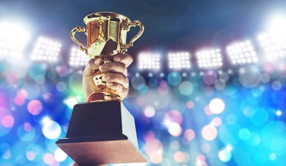 Man holding an award tile2