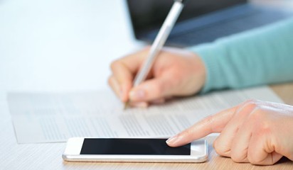 Mobile device with pen and paper in background thumbnail2